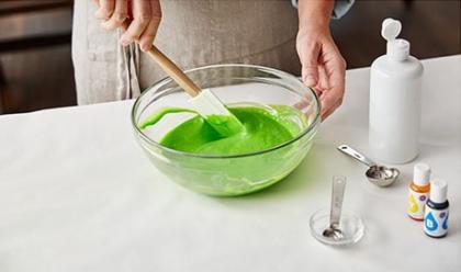 green food coloring added and mixed into bowl to make green slime