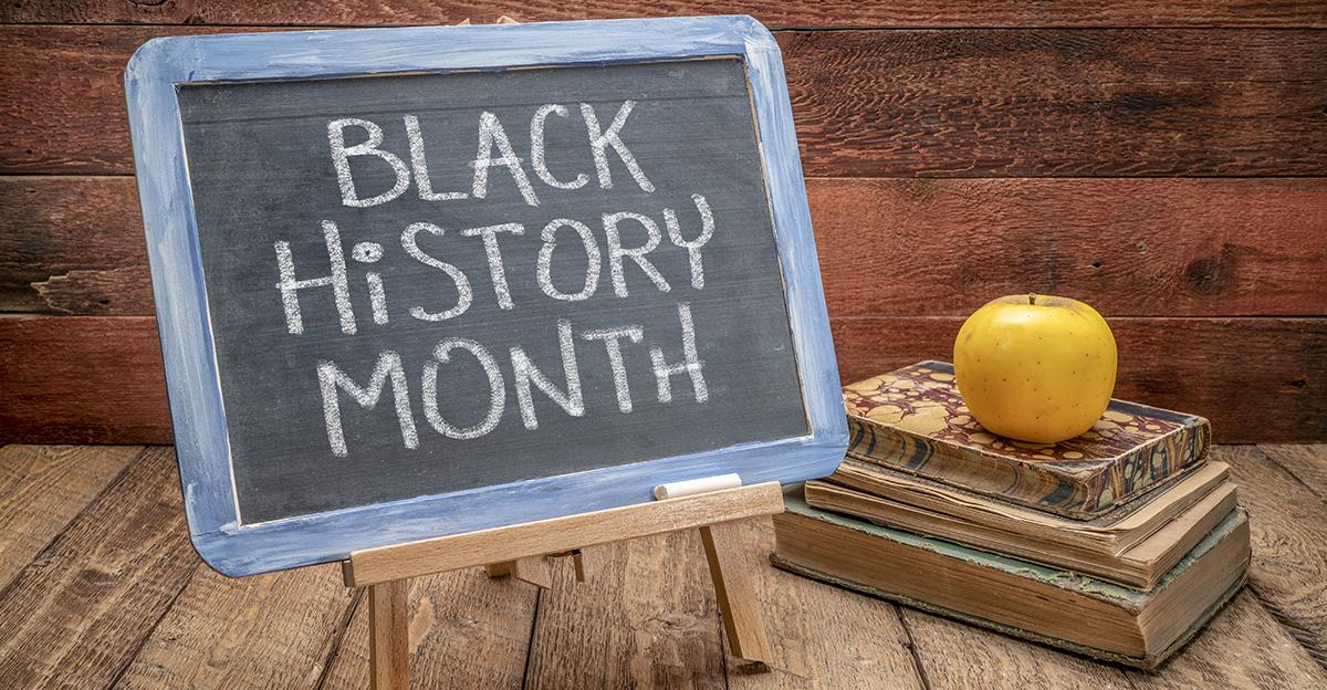 black history month text on classroom chalk board