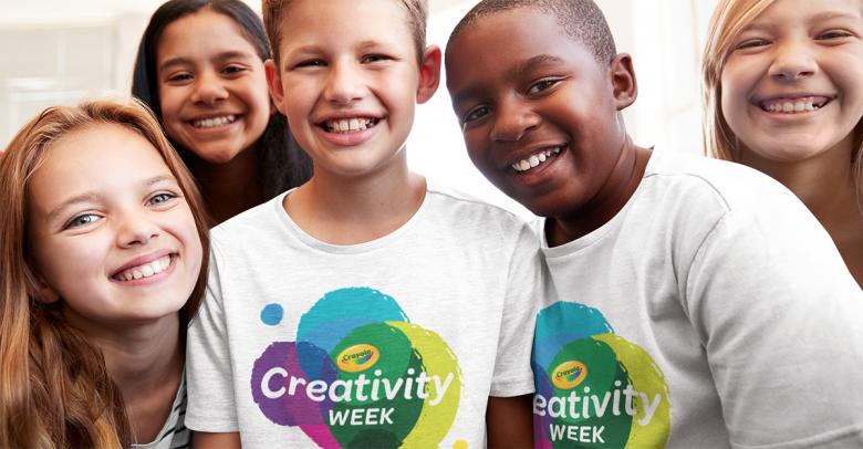 group of smiling kids wearing crayola creativity week shirts