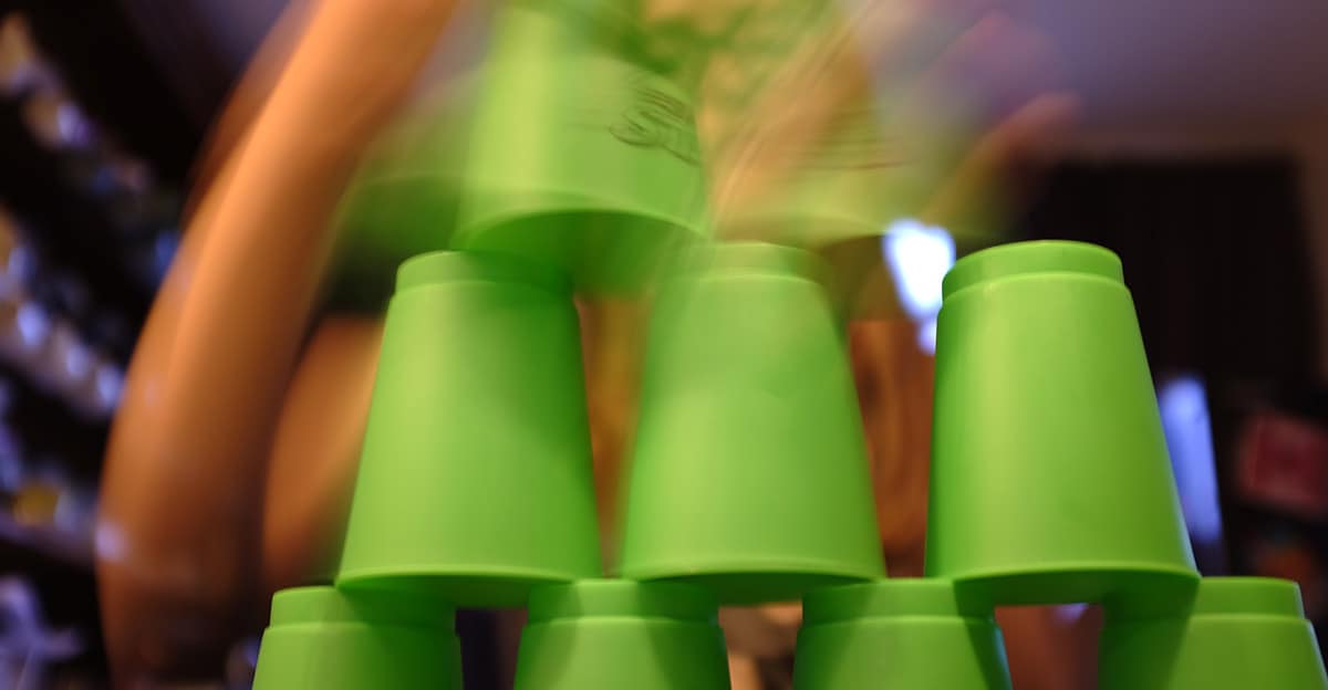 girl speed stacking with cups