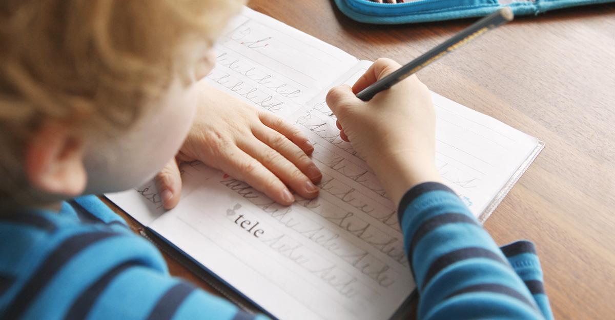 boy practicing handwriting skills