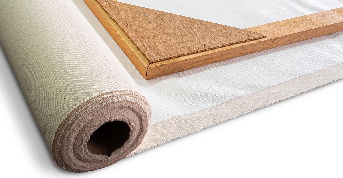 preparing a rolled canvas to stretch over a wooden frame