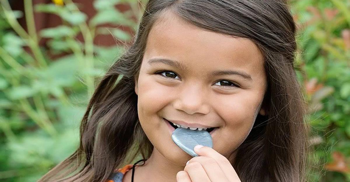 little girl with chewable pendant jewelry