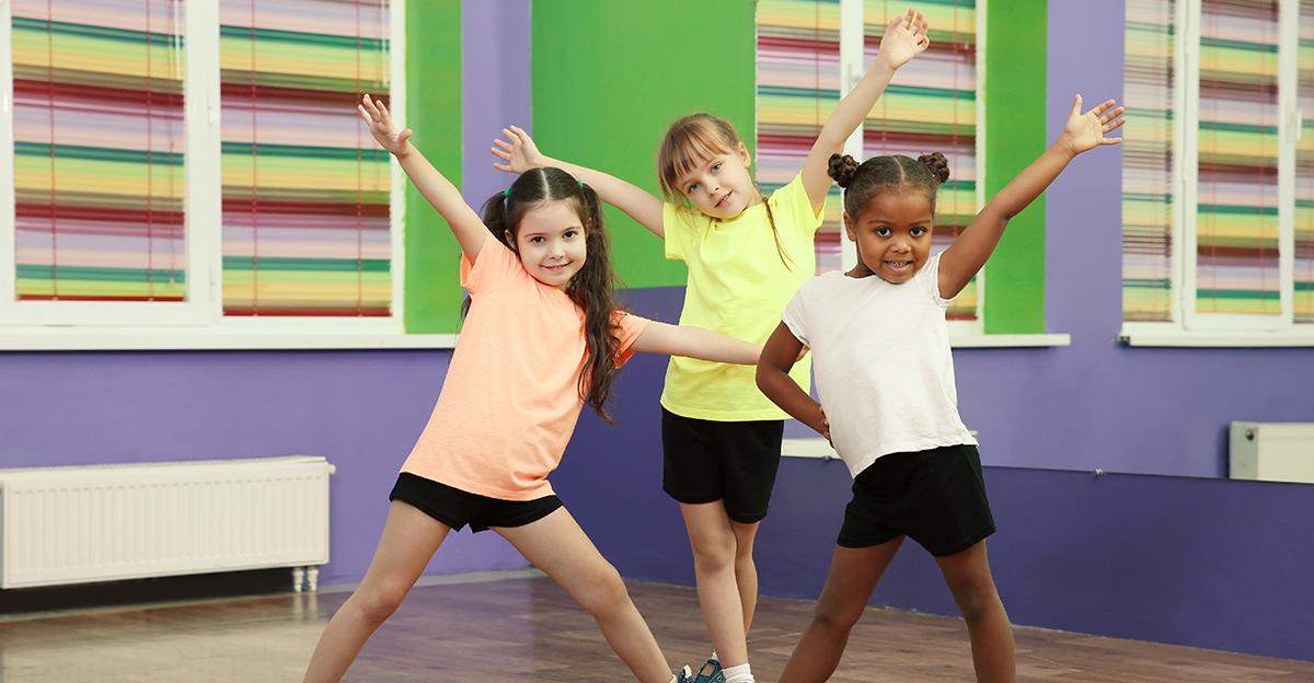 3 young students posing in dance class