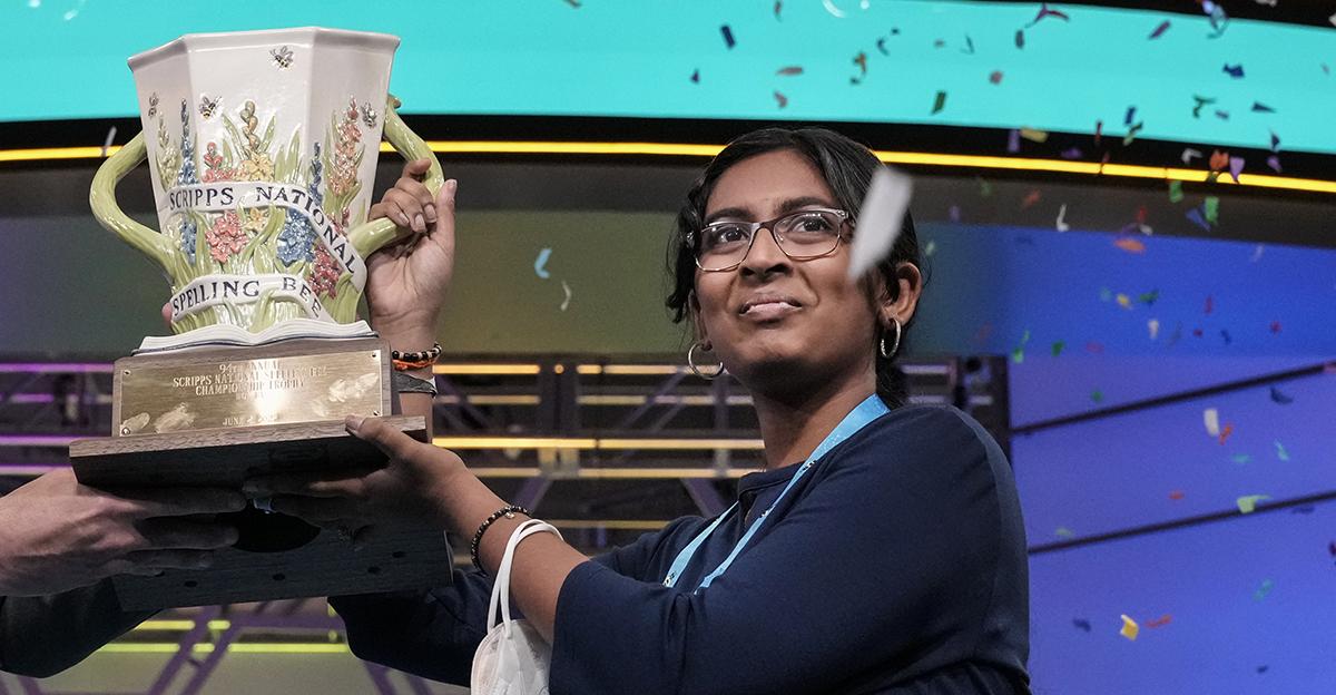 Harini Logan receiving trophy for winning the 2022 Scripps National Spelling Bee