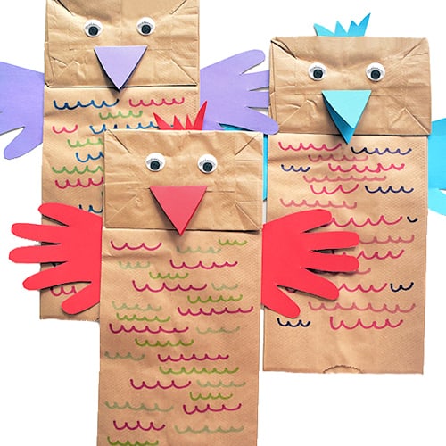 craft project of 3 paper bags with added construction paper to make them into birds