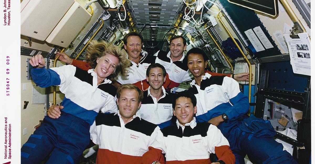 astronauts posing for a picture on the space shuttle Endeavour in 1987, including dr mae jemison, the first black female astronaut to go to space