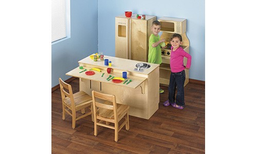 two children playing in a dramatic play pretend kitchen