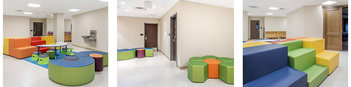 school hallways with colorful soft seating and a standing desk