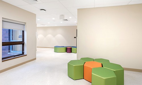 school hallway with soft seating areas