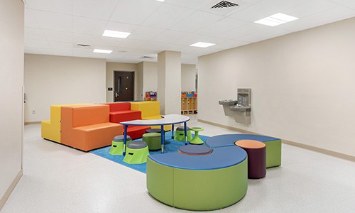 early childhood classroom with soft seating and configurable furniture