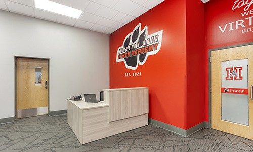 inside entry for cyber academy with check-in desk