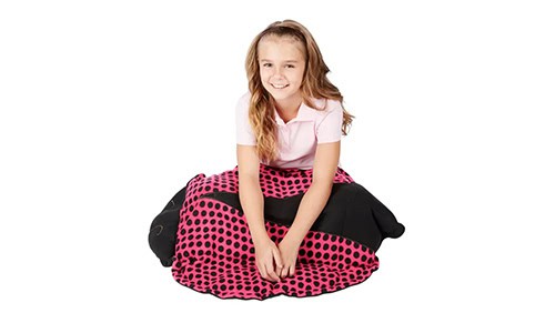 girl with a weighted ladybug blanket on her lap