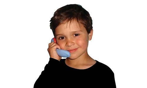 young boy using a phone-shaped auditory tool
