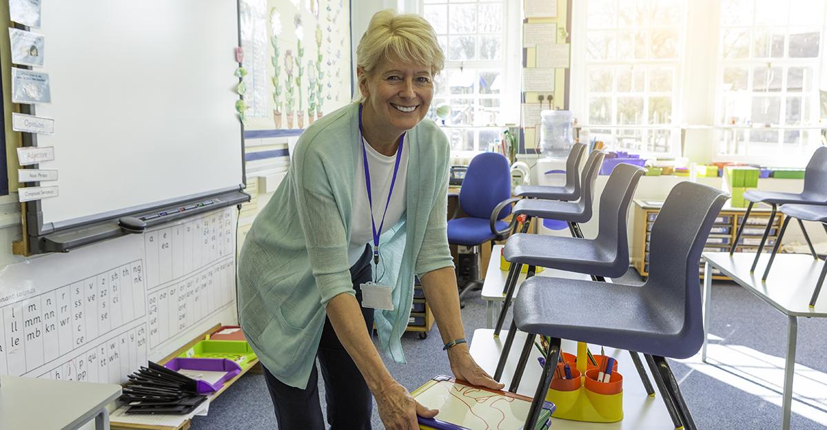 teacher cleaning and organizing her classroom at the end of the school day