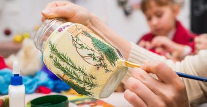decoupage art on a glass jar using mod podge glue and sealer