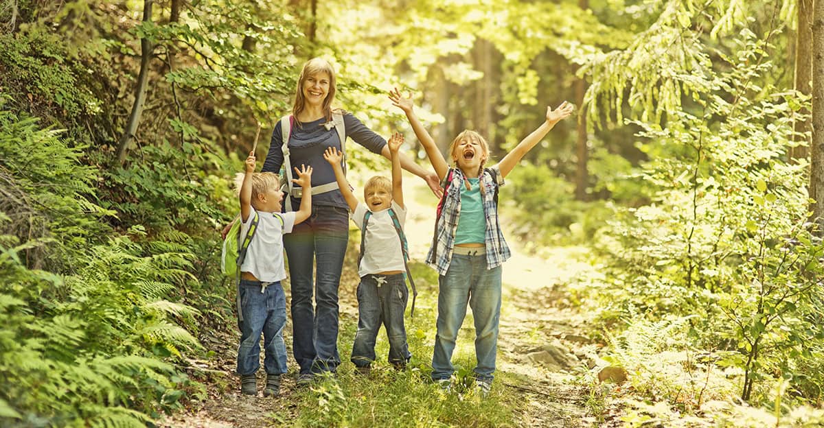 mother and her kids hiking