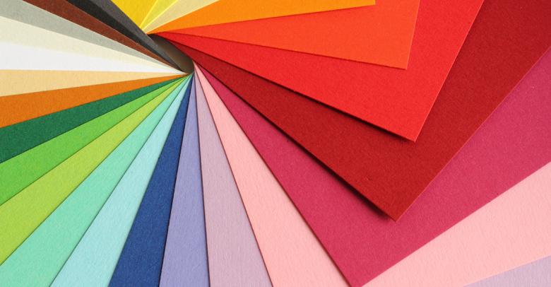 colorful construction paper spread out in a spiral shape