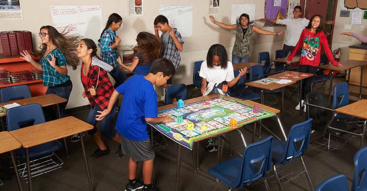 students in a classroom playing a math game that includes physical activity