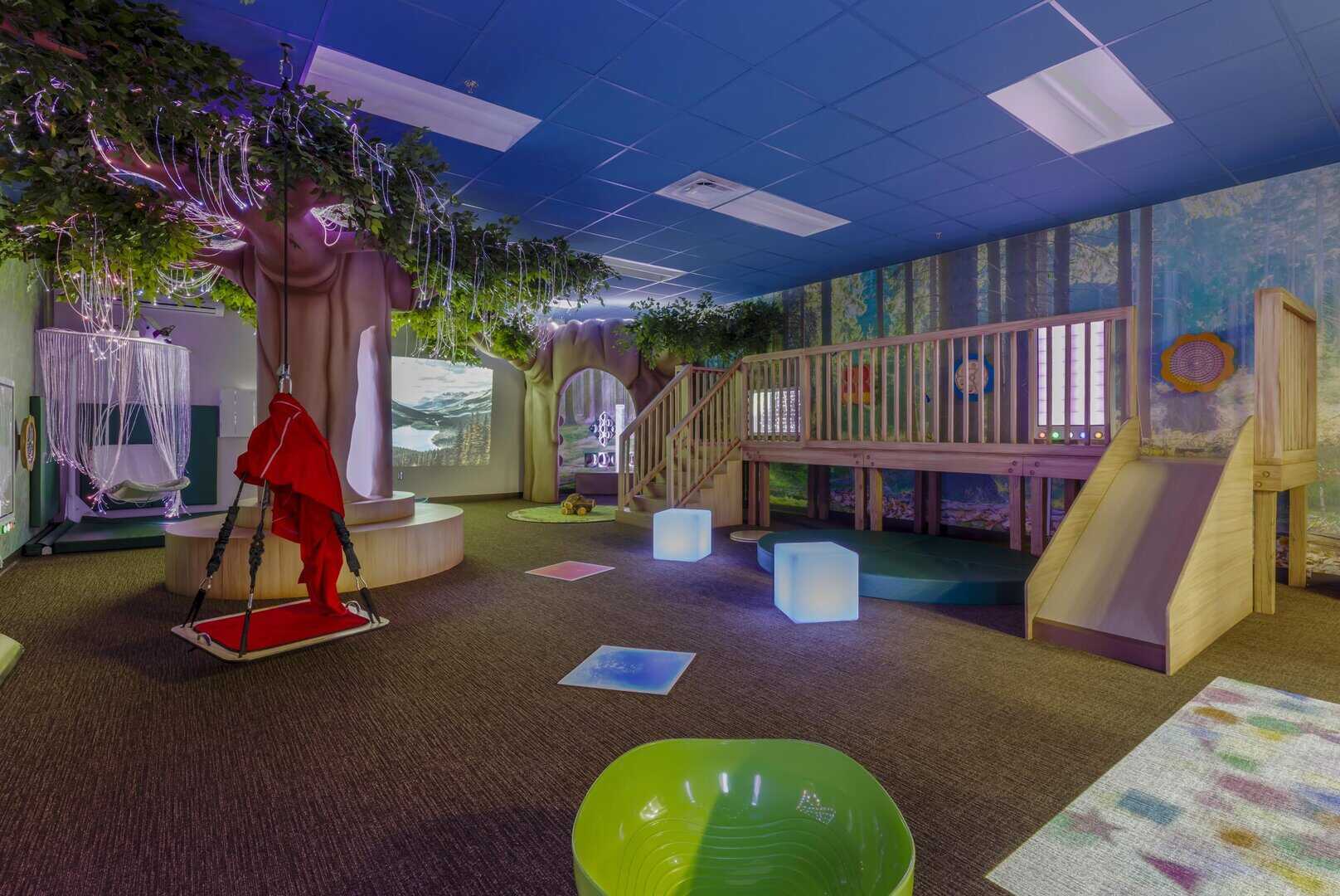 a playroom with a slide and a slide