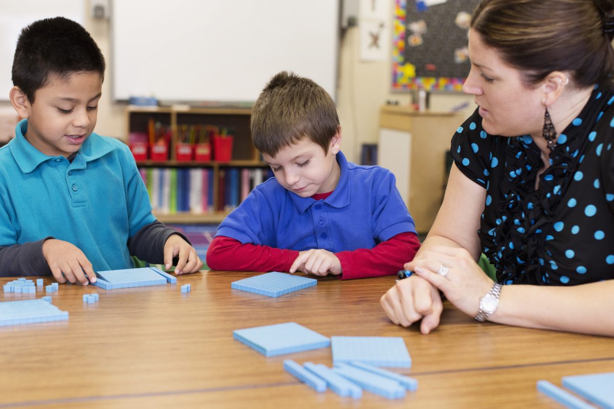 Students and teacher counting in classroom